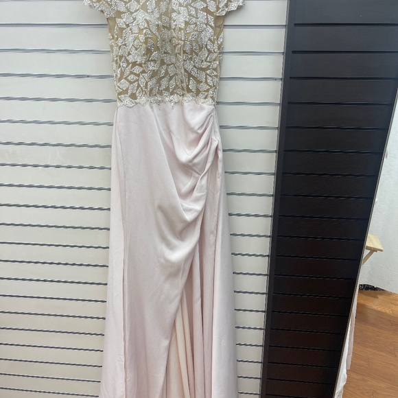Beautiful beaded mesh top with a thigh high split in pastel pink gown